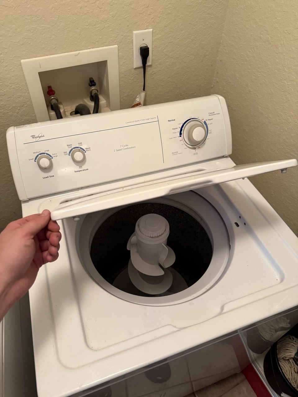 Washer repair in progress in a Naples home