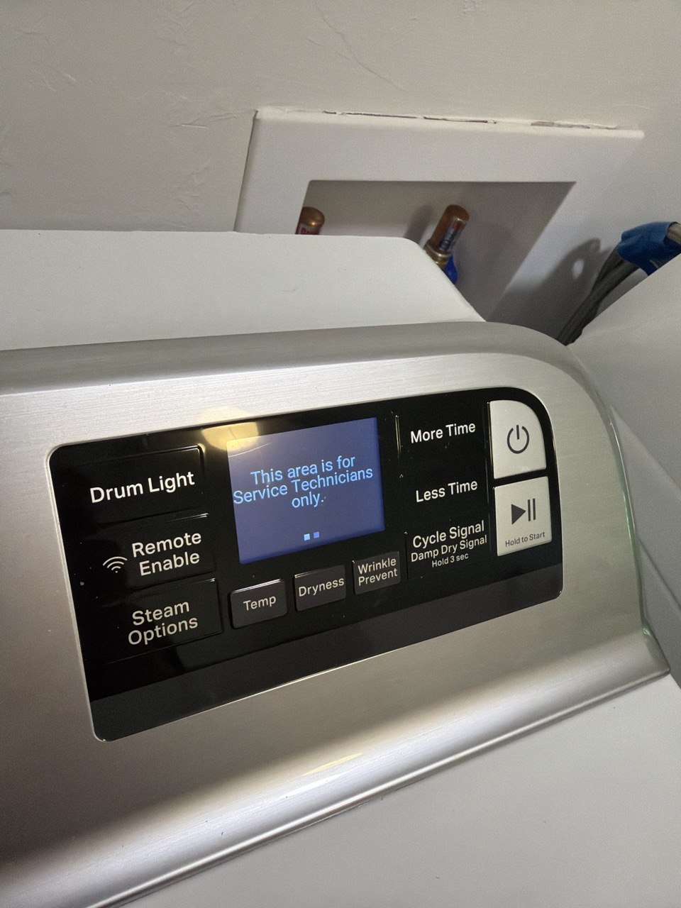 Washer repair in progress in a Naples home