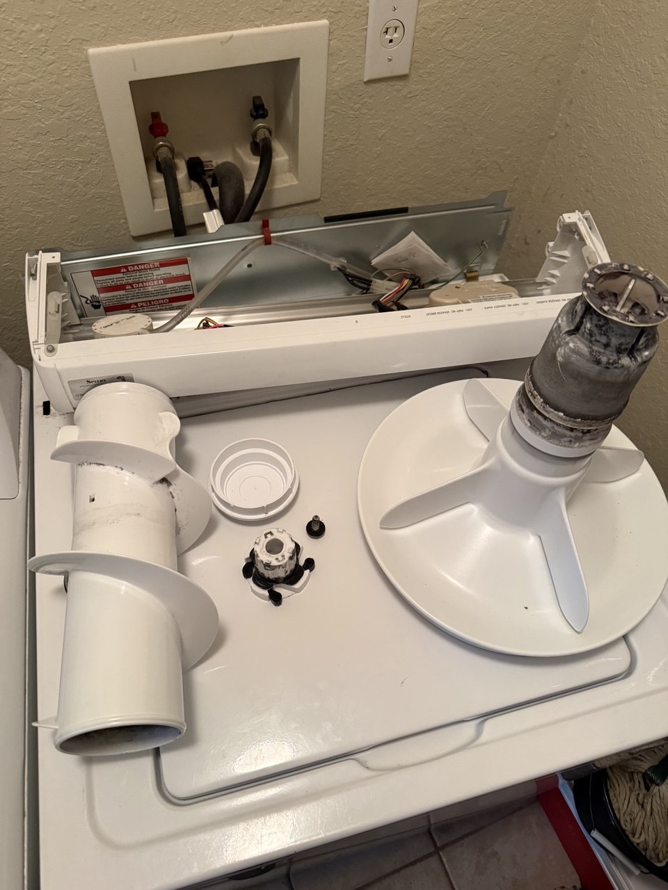 Washer repair in progress in a Naples home