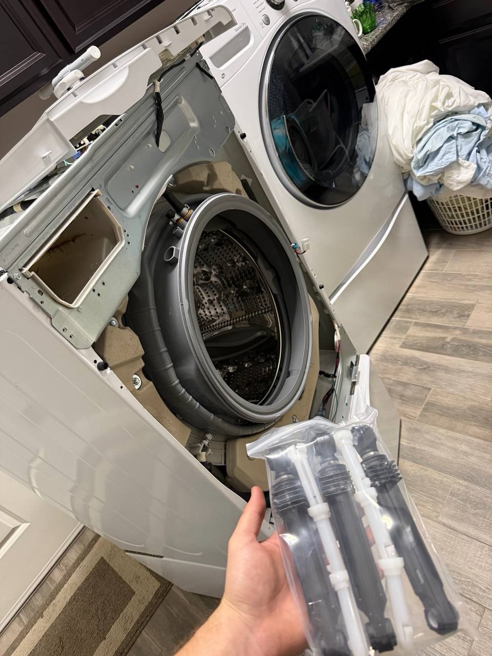 Washer repair in progress in a Naples home