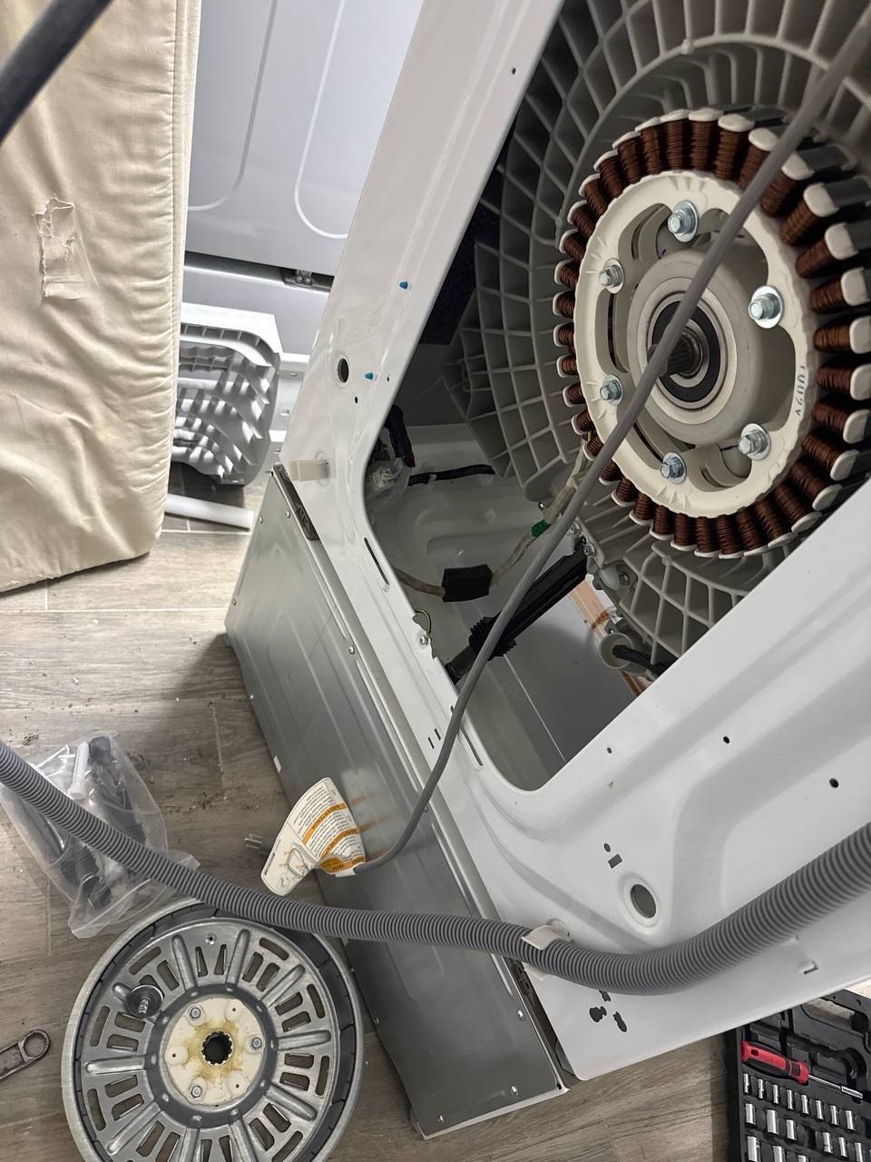 Washer repair in progress in a Naples home