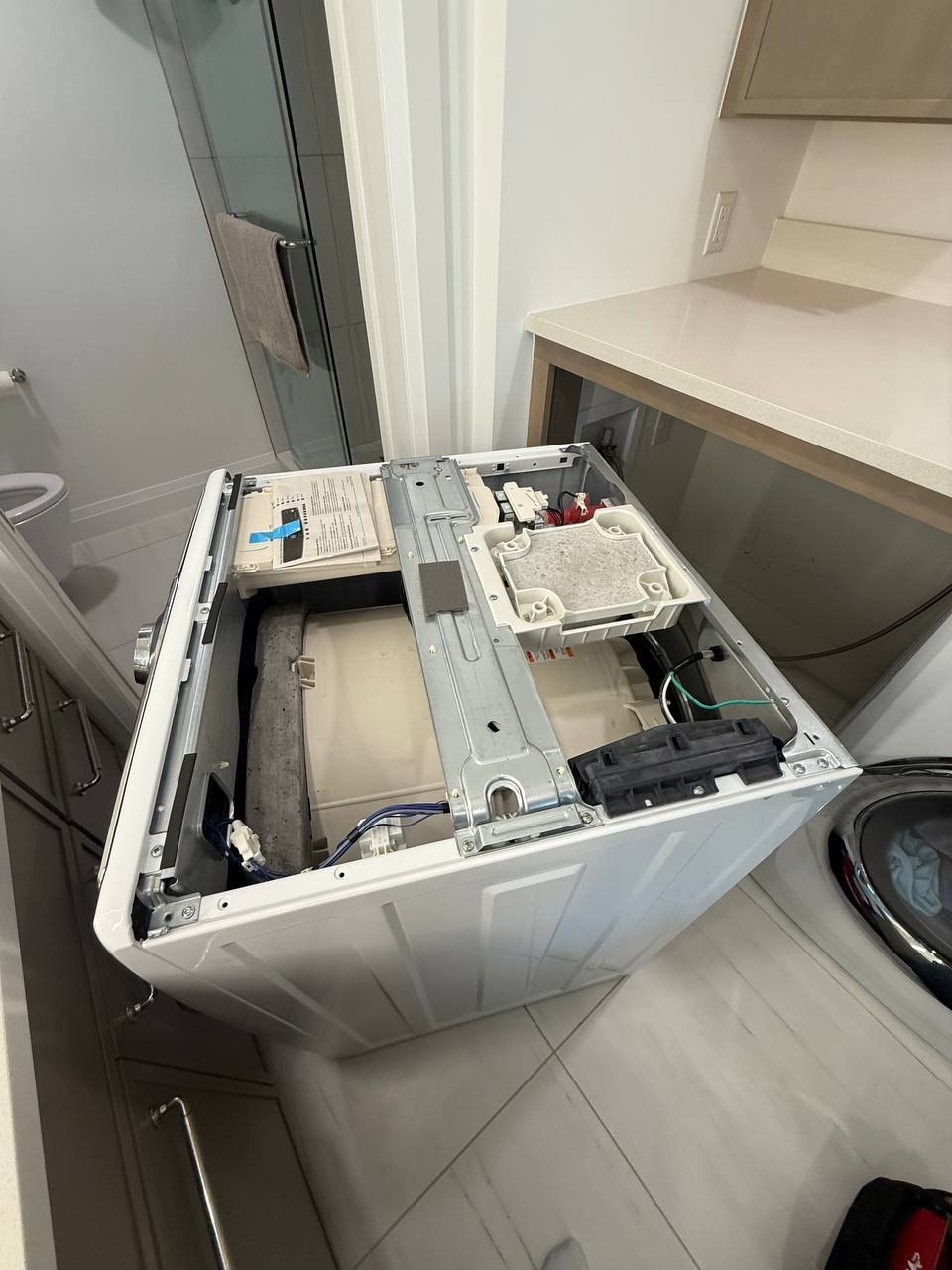 Washer repair in progress in a Naples home