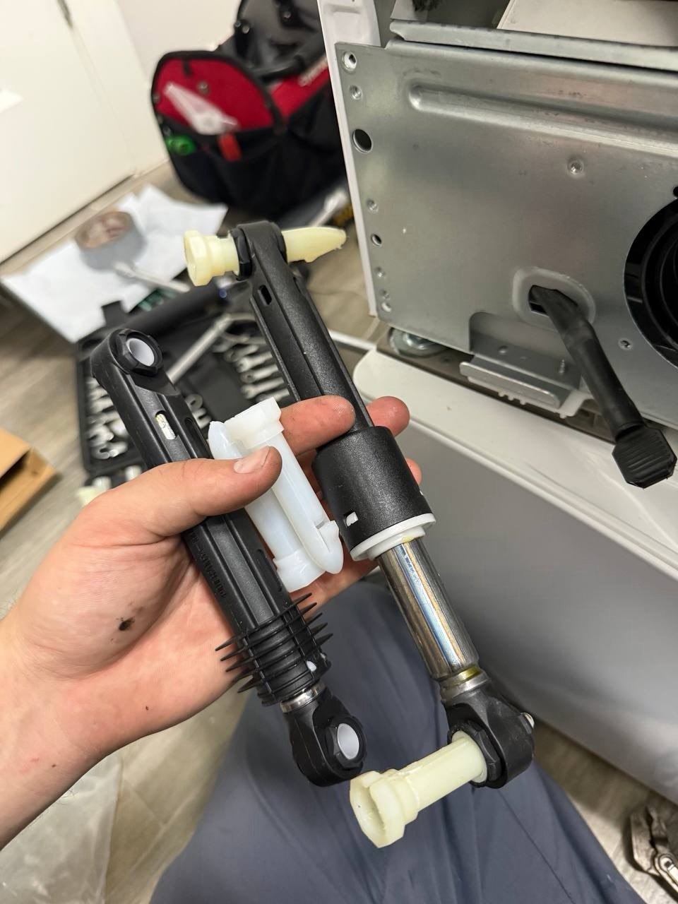 Washer repair in progress in a Naples home